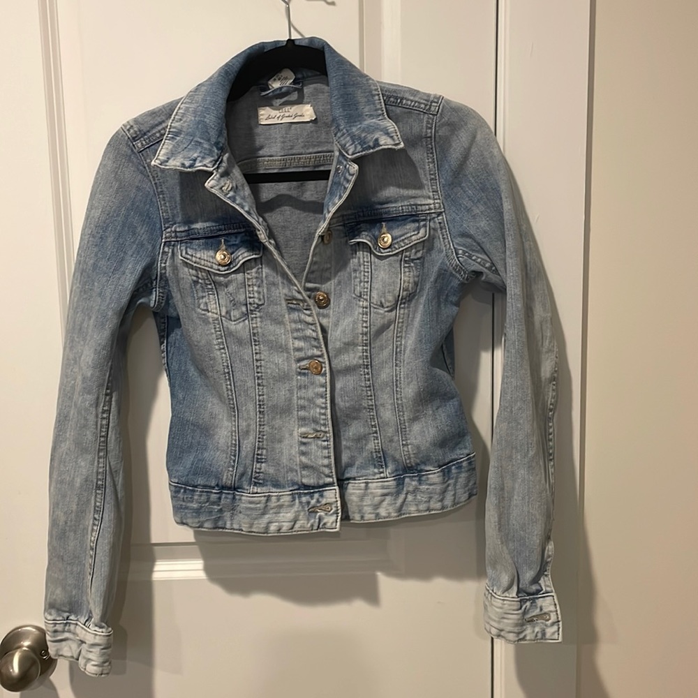 Light blue distressed jean jacket.